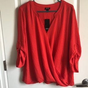 Loose flowing v neck blouse with button up sleeves